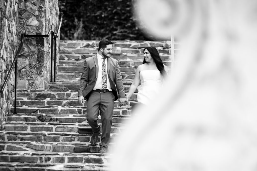 Couple walking the stairs at Bella Collina