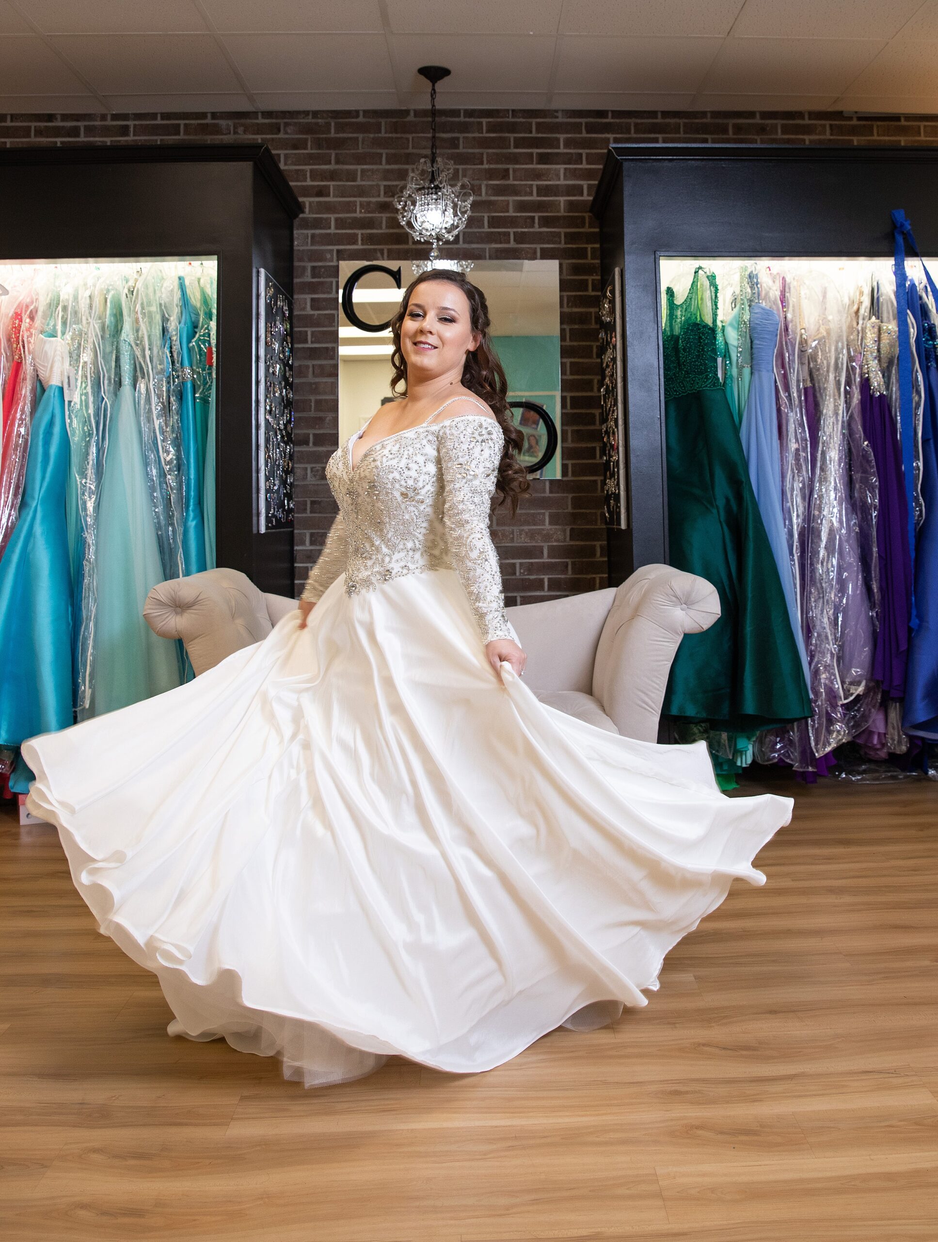 A bride twirls in her dress in the getting ready room at her deercreek country club wedding