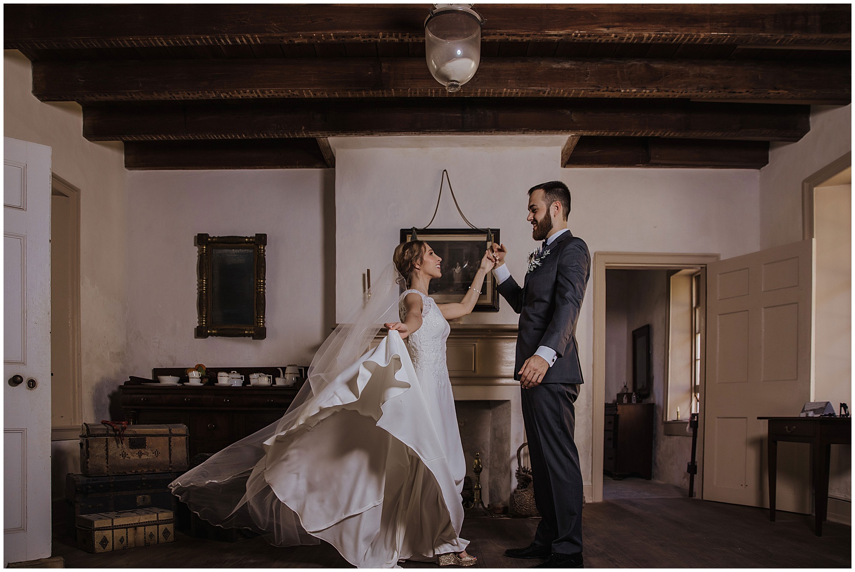 Newlyweds dance together in an historical room at flagler college wedding