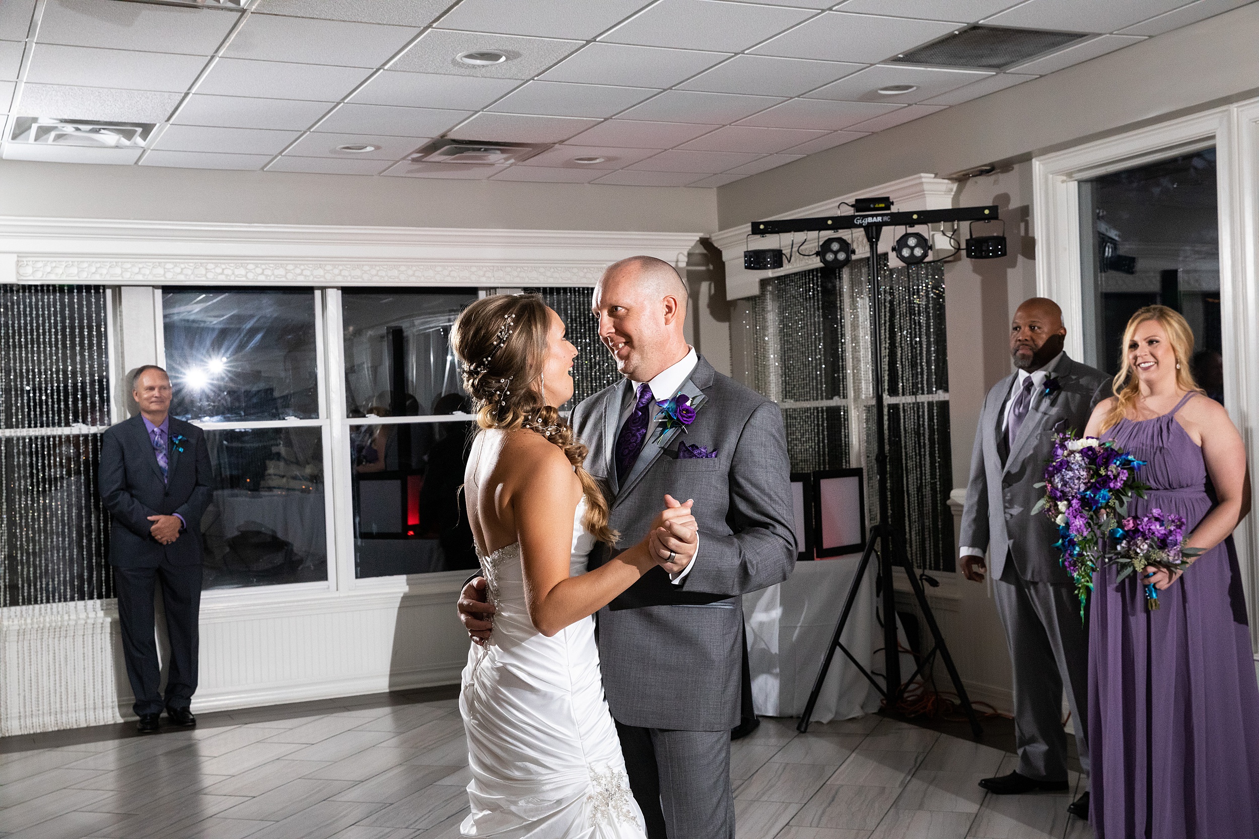 Newlyweds dance for the first time on the dance floor at their magnolia point wedding