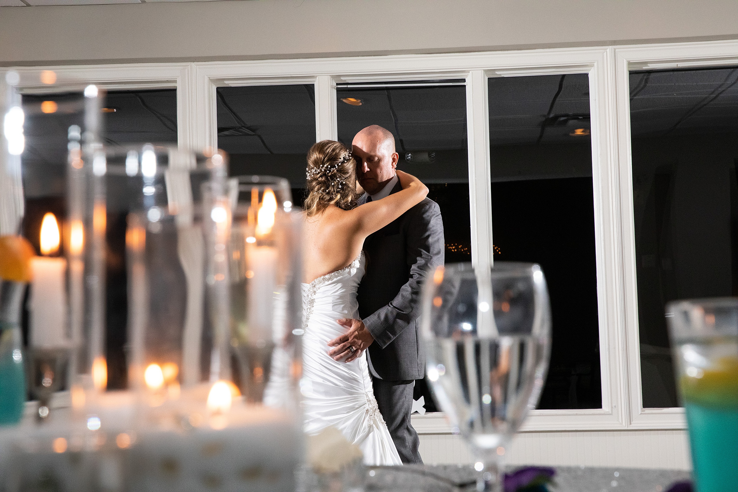 Newlyweds share an intimate dance at there magnolia point wedding reception