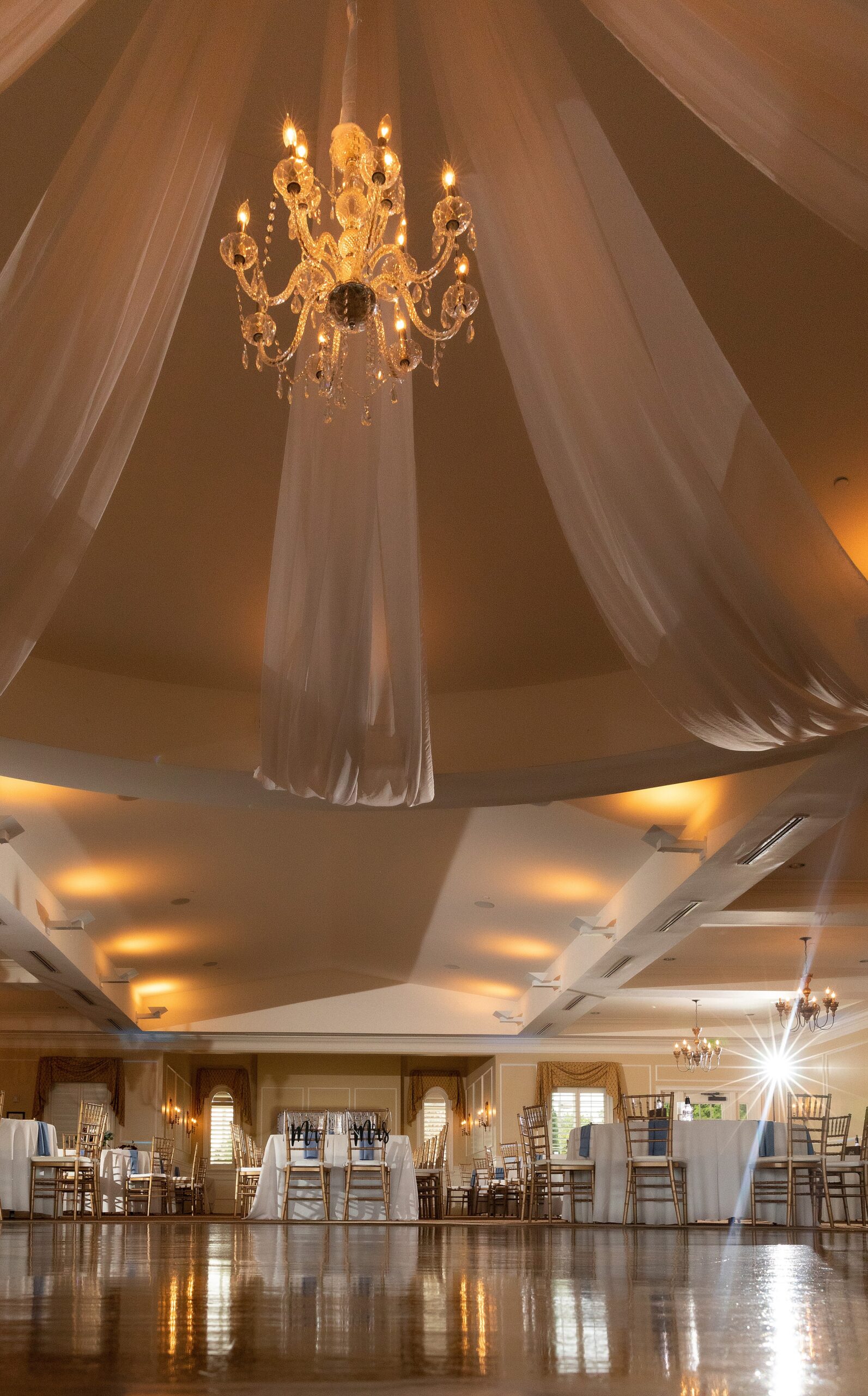 Details of the crystal chandelier and drapery of the river house events wedding reception venue