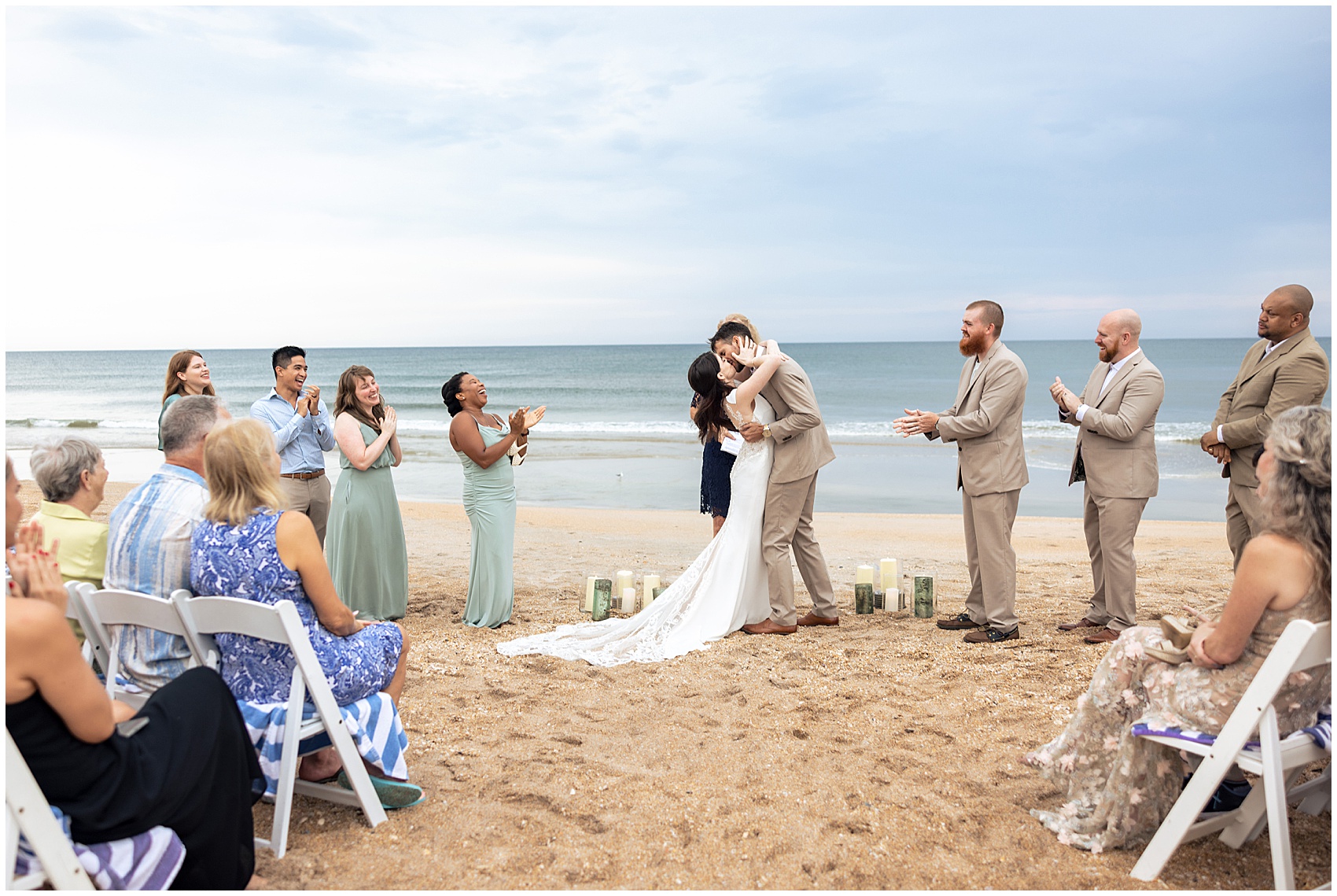 Newlyweds kiss to end their beach wedding ceremony at their serenata beach club wedding