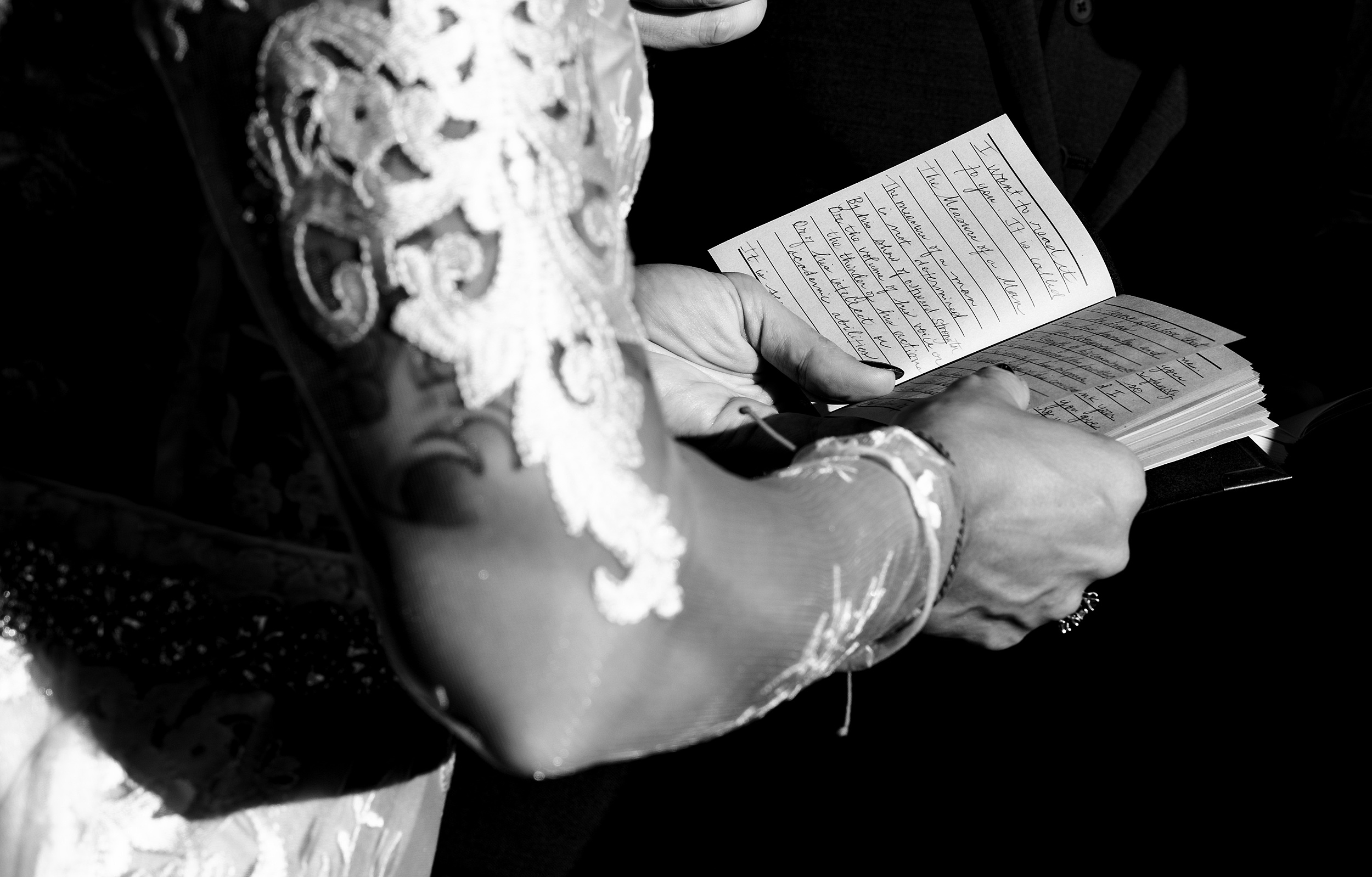 Details of a bride reading her vows in a book at her a1a ale works wedding