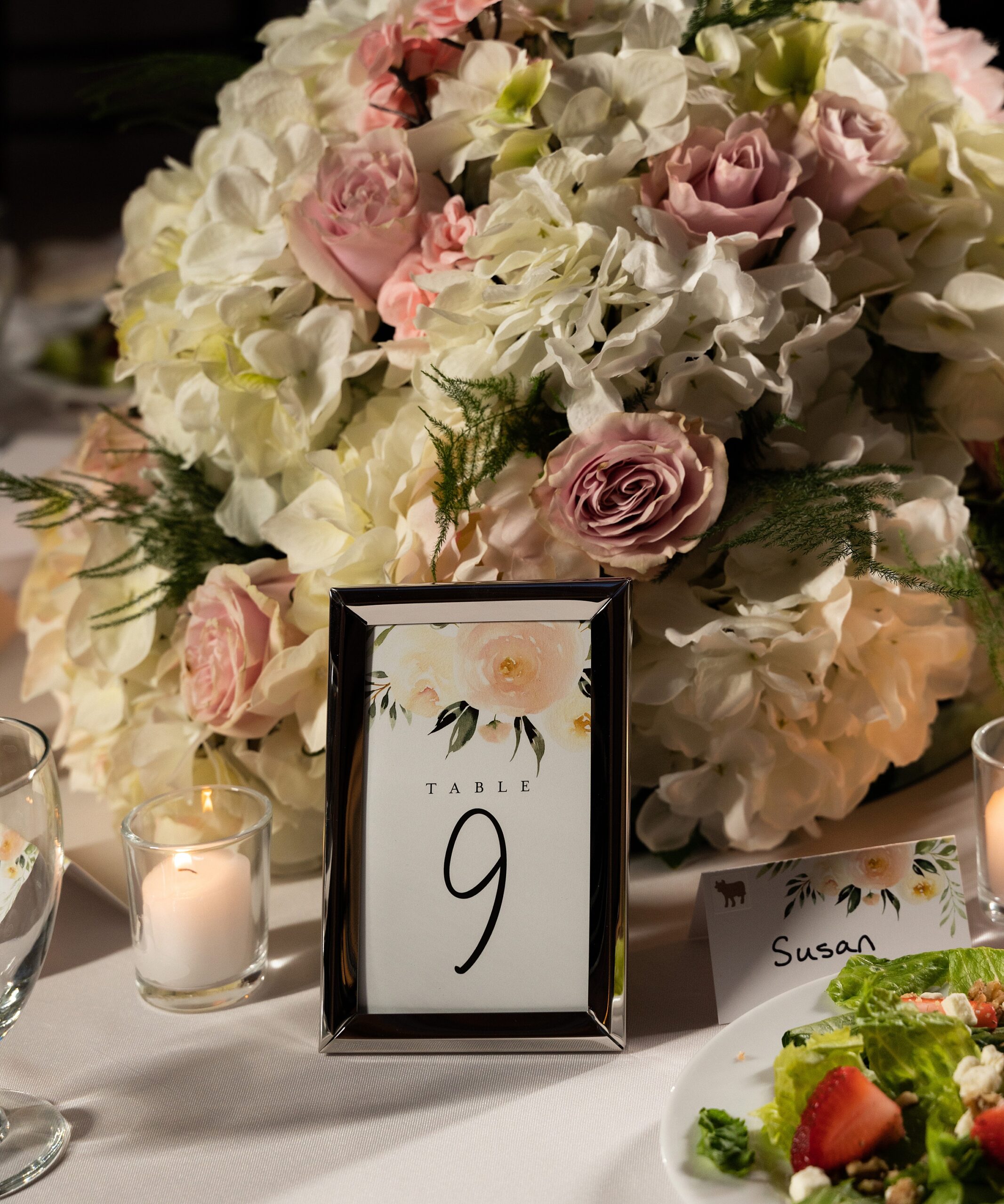 Details of a table setting with large flowers at a casa feliz wedding
