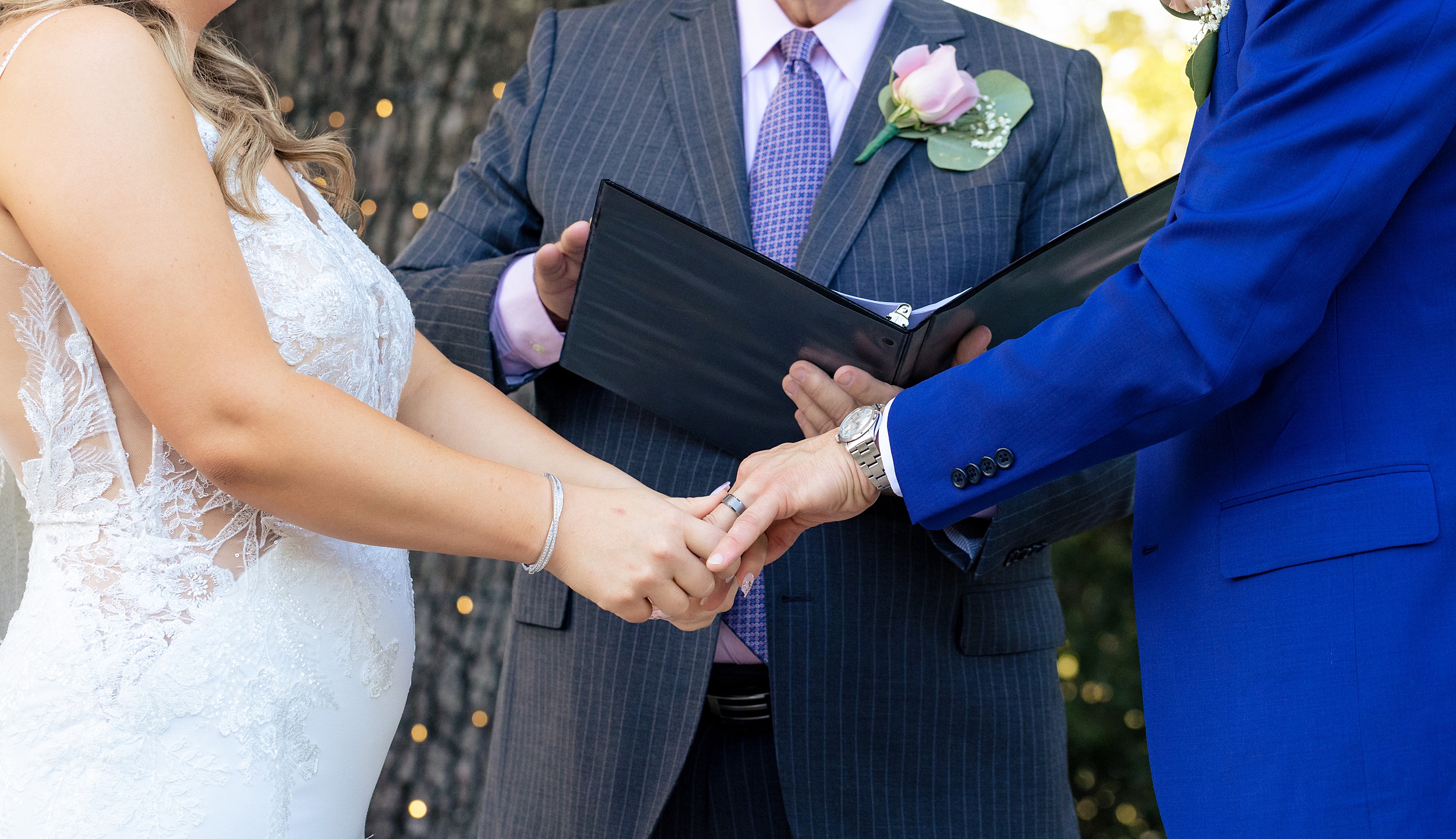 Details of newlyweds holding hands during their wedding tpc sawgrass wedding ceremony