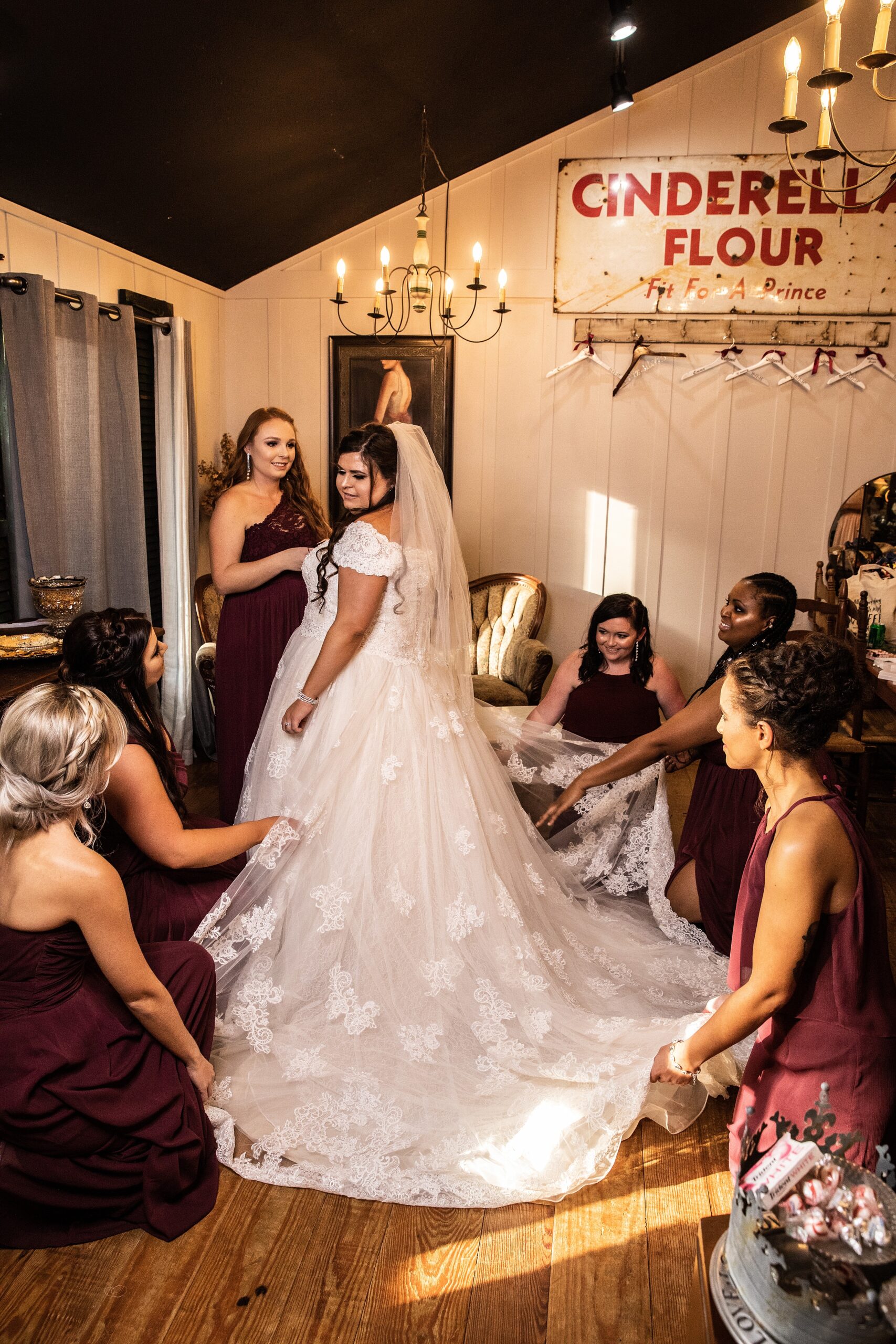 A bride gets ready with her entire bridal party in the getting ready room