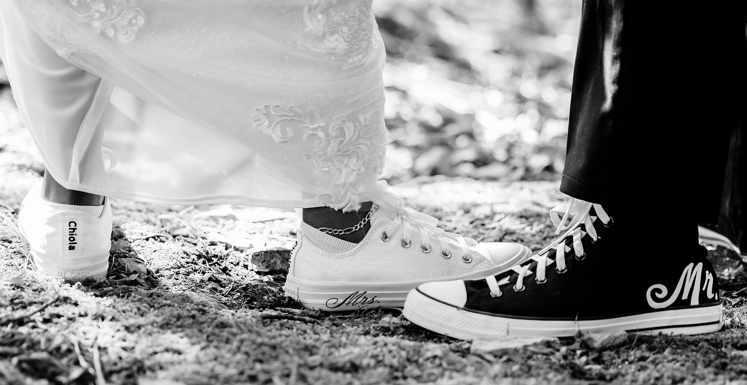 Details of bride and groom matching mr. and mrs. converse shoes
